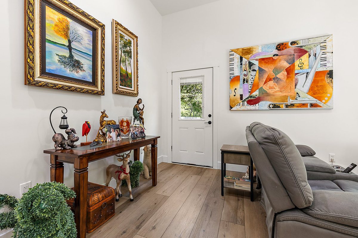 Clean entry area with finished flooring and wall detail.