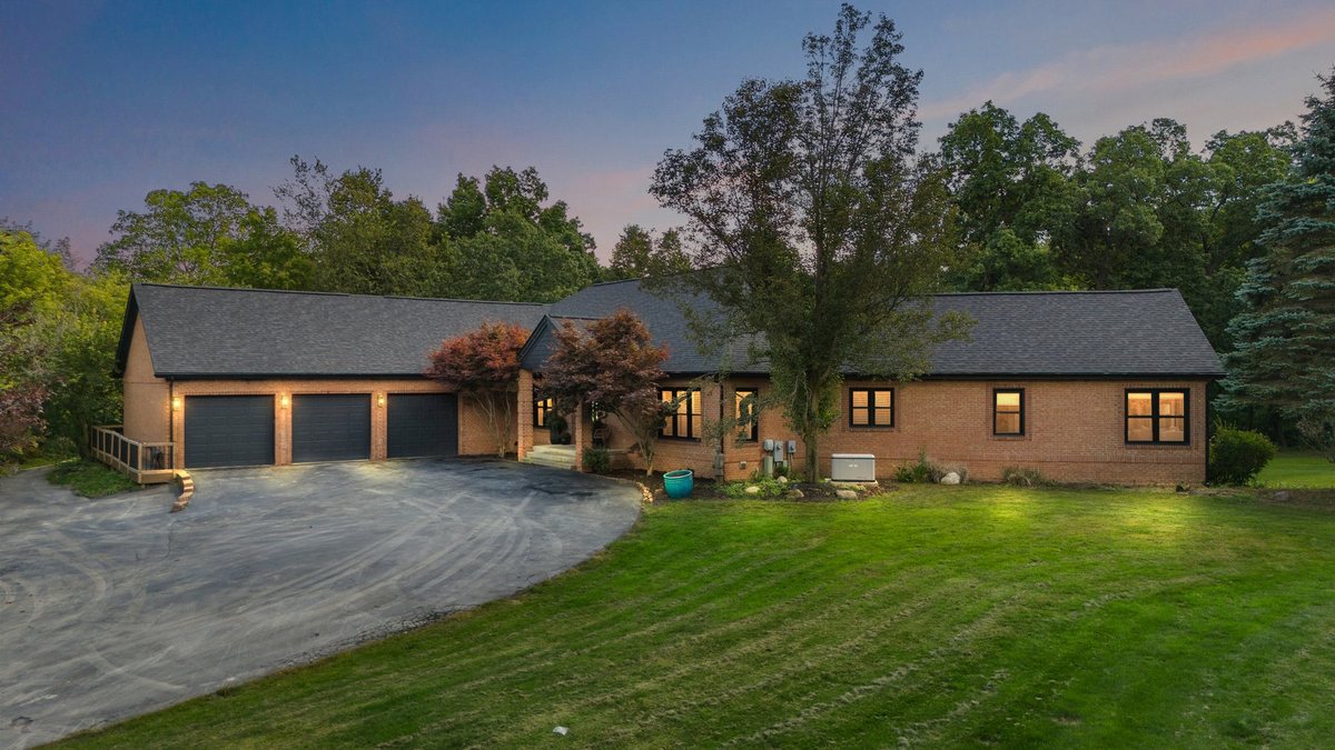 Finished residential exterior with clean driveway and lawn.